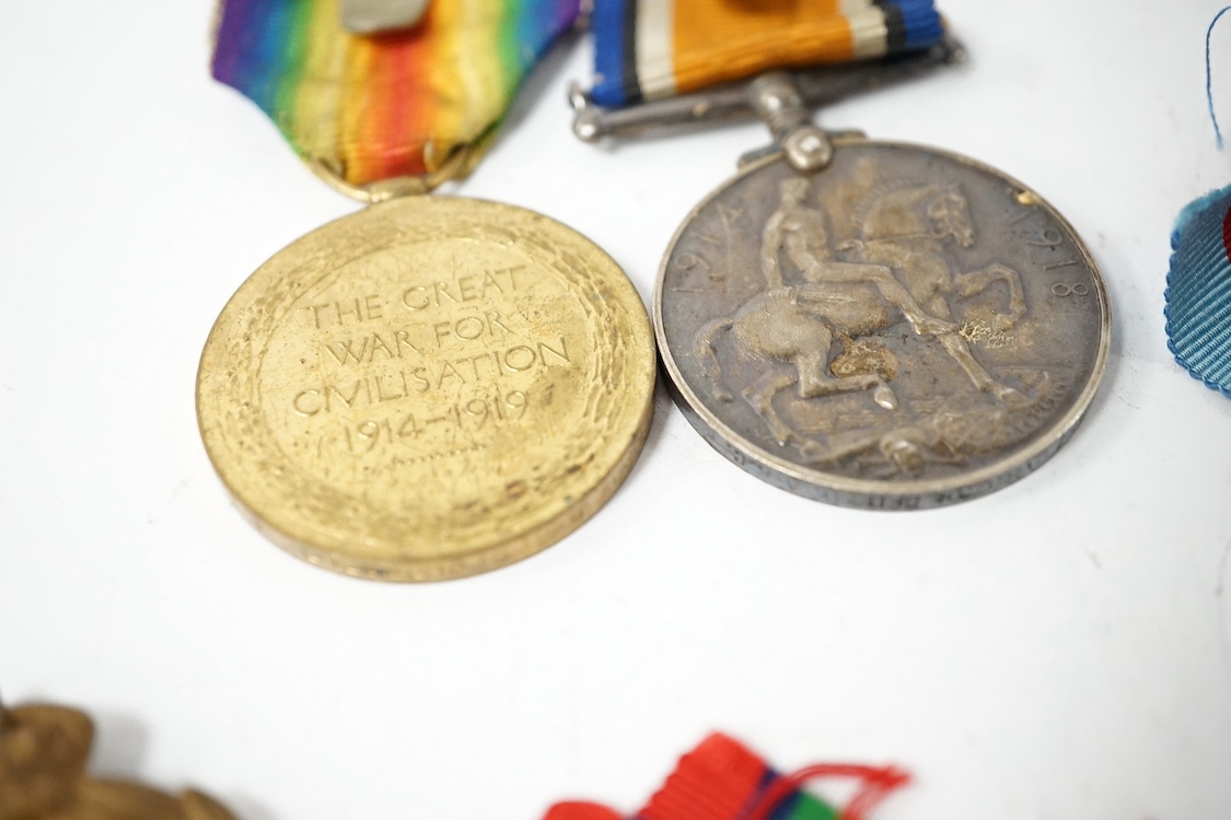 Nine military medals including; a First World War medal pair to T3-026887 DVR. C. Oldfield. A.S.C., a WWII group comprising; The Atlantic Star, The 1939-1945 Star, The Italy Star and The 1939-1945 Medal with a clasp for